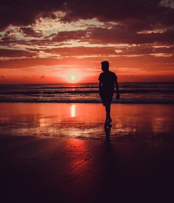 A serene person meditating in a calm, warm-toned environment.